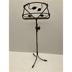 A wrought iron adjustable music stand, with tendril detail, H121.