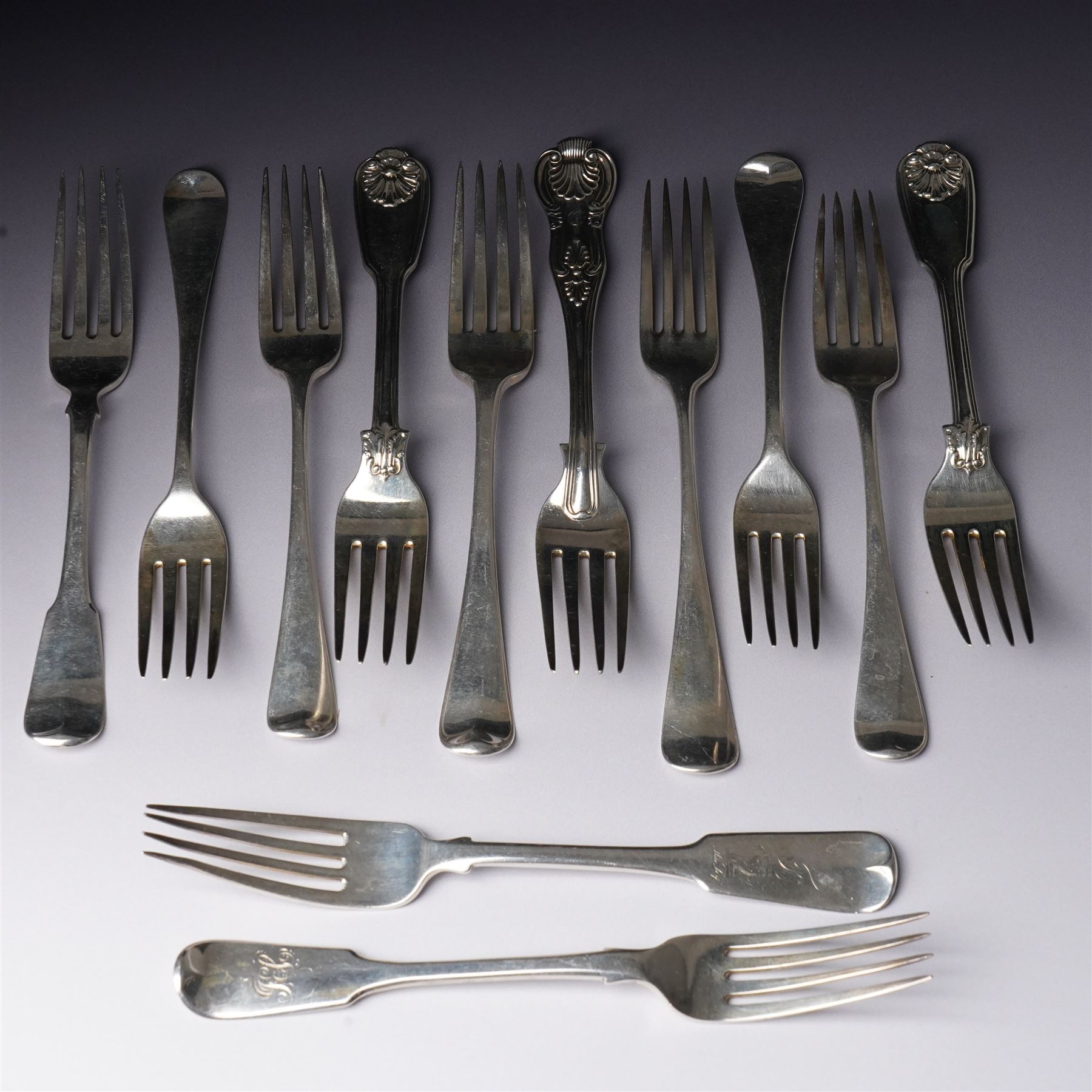 Pair of George IV silver fiddle, thread and shell pattern table forks Lonson 1826 and ten other 19th century silver table forks, various dates and makers (12)