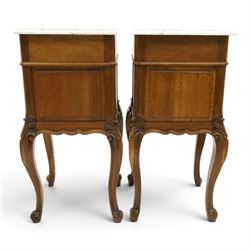 Pair of 20th century French honey oak and marble bedside cabinets, the square marble top with moulded edge, fitted with single drawer over panelled cupboard, shaped and moulded apron over scrolling acanthus leaf applied knees terminating to cabriole legs with scroll feet