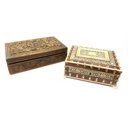 An early 20th century Indian Vizagapatam box, detailed with pierced ivory panels and raised upon four paw feet, H8cm L20.5cm D15.5cm, together with an Eastern hardwood box carved with foliate panels. 