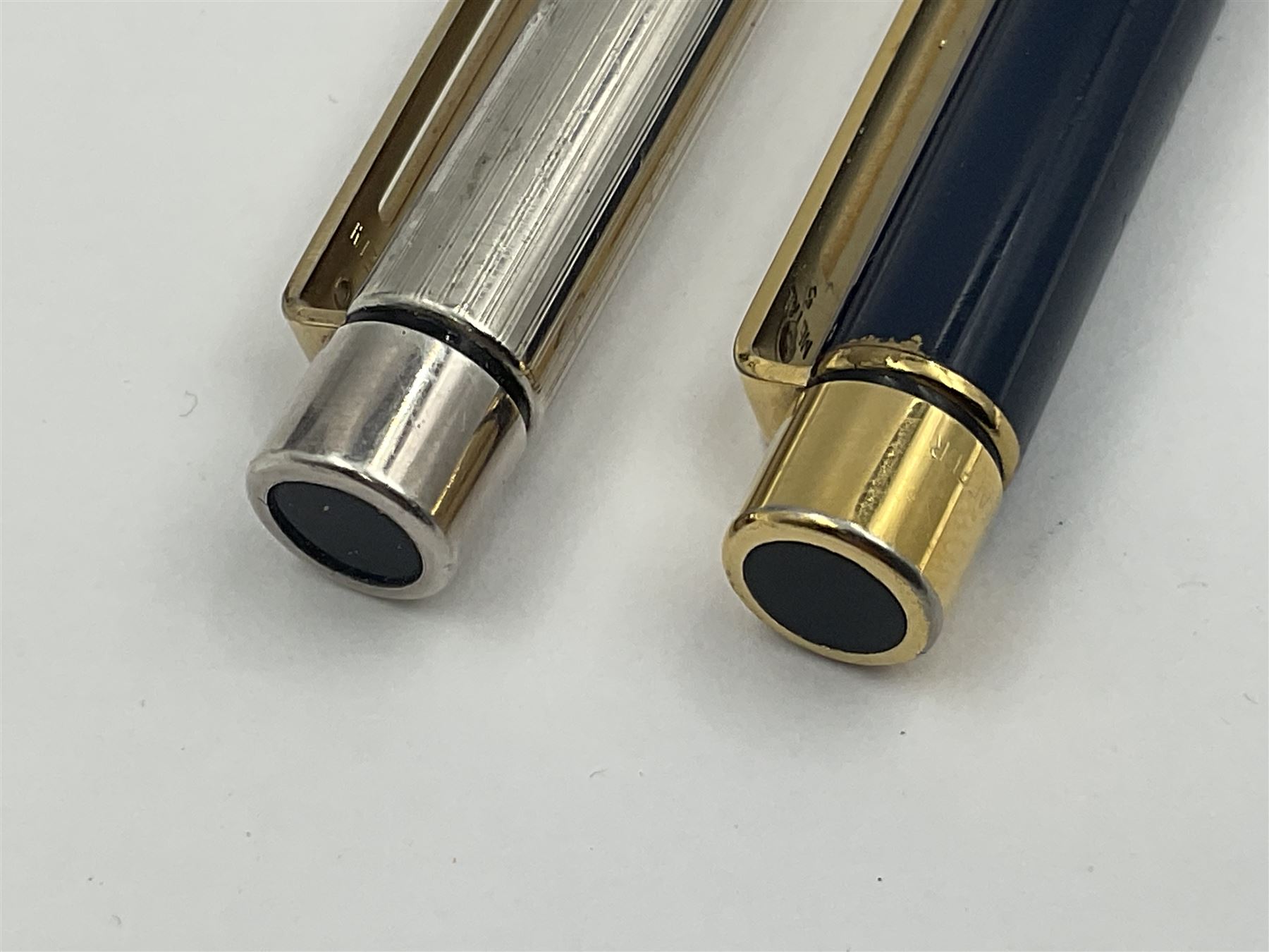 Sheaffer Targa 1011 Diamond Square fountain pen, the gold plated barrel with nib stamped 14K 585, together with another Sheaffer Targa fountain pen with blue barrel and gold nib stamped 14K 585 and matching ballpoint, and Sheaffer ballpoint pen with sterling silver barrel, largest L13.5cm (4)