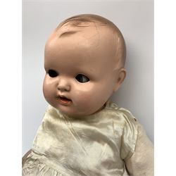 Seyfarth & Reinhardt composition head baby doll with moulded hair, sleeping flirty eyes, open mouth with one tooth and tongue and soft body with composition jointed limbs, marked 'SuR Germany 30/5' H47cm; together with a Golborne Dolls 'Golborne Beauty' composition head and body bride doll, marked 'F.P.23' in original box H63cm (2)