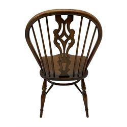 Four medium elm Windsor chairs, high comb back with shaped splat, saddle seat