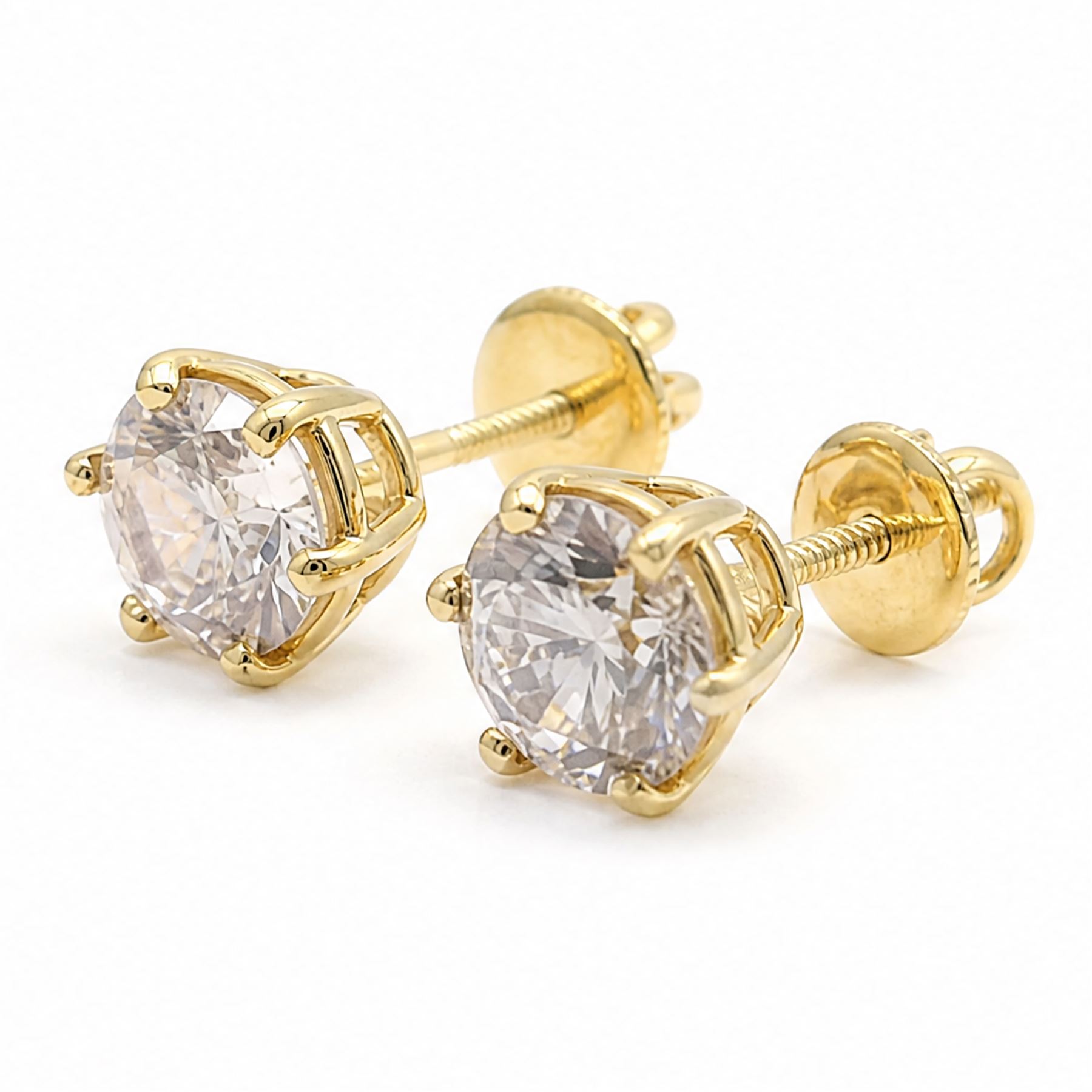 Pair of 18ct gold diamond earrings, each screw back stud set with a single round brilliant cut diamond, total diamond weight approx 3.15 carat
