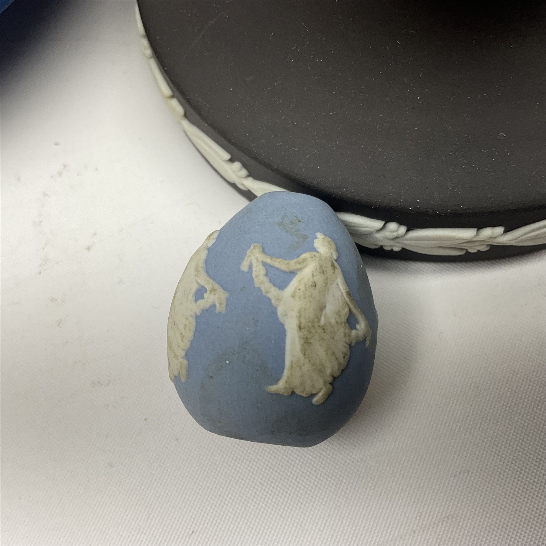 Collection of Wedgwood Jasperware, to include black Eisenhower Bust, two black basalt paperweights, one depicting an eagle and one depicting Julius Caesar, a blue Zodiac plate, Man on the Moon commemorative plate, American Independence Bicentennial plate and Royal commemorative ware, etc, all with impressed marks beneath, some with boxes