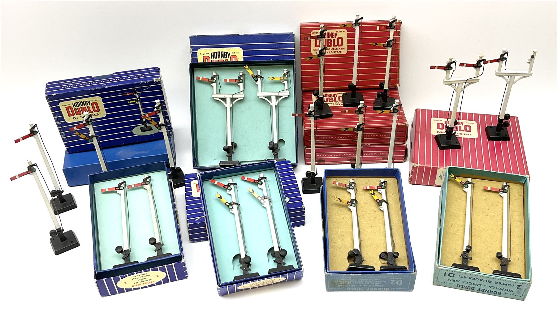 Hornby Dublo - twelve manually operated semaphore signals comprising one 5050 Signals Single Arm (D1) 2 Home, one 5060 Junction Signals (D3) 2 Home; D3 Junction Signal Upper Quadrant (1 Home 1 Distant); two 5055 Signals Double Arm (D2) 1 Home 1 Distant; two D2 Signals Double Arm (Upper Quadrant); three D2 Signals Double Arm Upper Quadrant Home - Distant; and two D1 Signals Single Arm Upper Quadrant; all boxed (12)