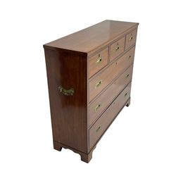 Georgian military type campaign chest, narrow rectangular top over three short and three long drawers, recessed brass handles, on bracket feet