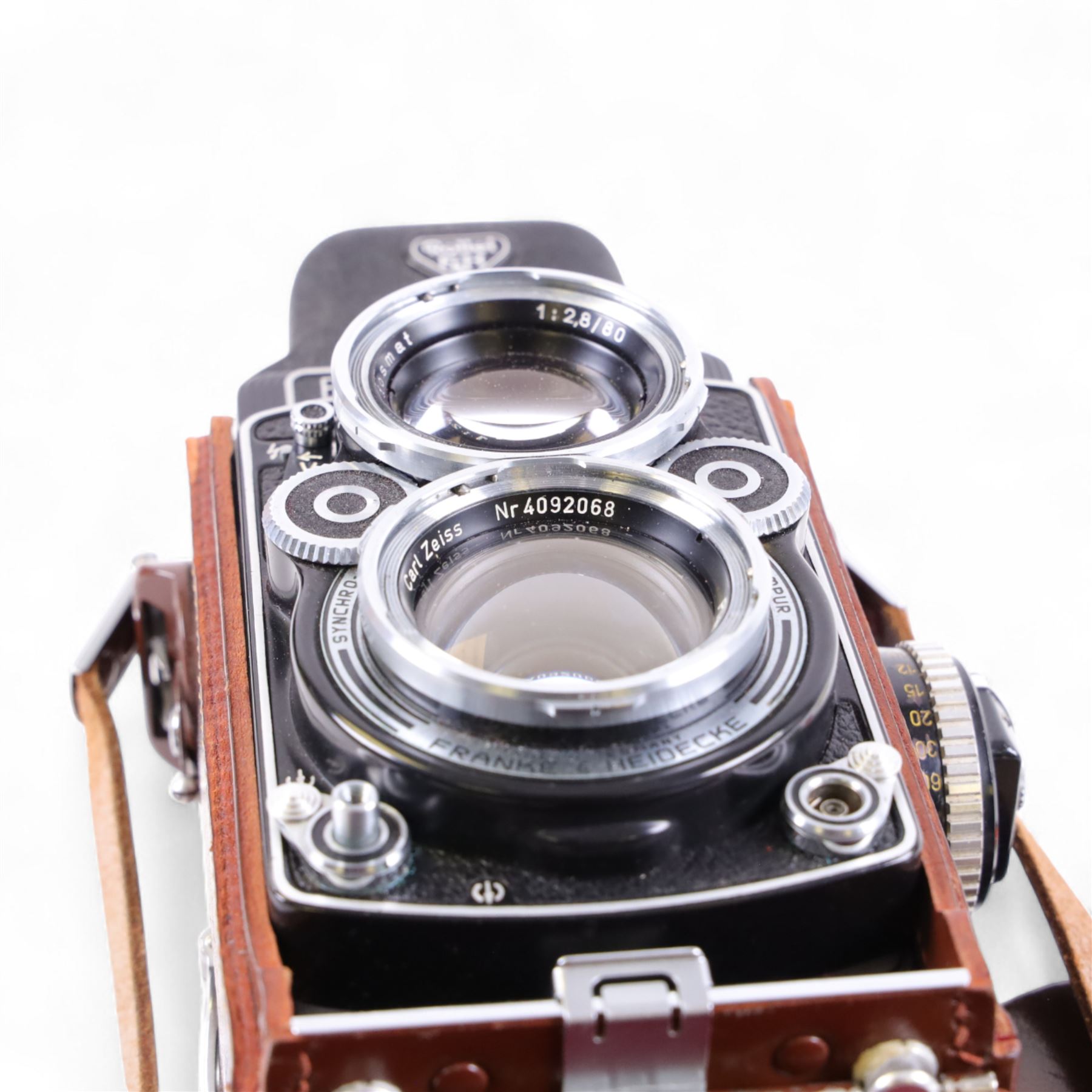 Rolleiflex Franke & Heidecke DBP DBGM 2.8 F TLR camera serial no. 2439093, with a Heidosmat 1:2.8/80 lens serial no. 894062 and a Carl Zeiss Planer 1:2.8 f=80mm lens serial no. 4092068, in leather case with instruction booklet