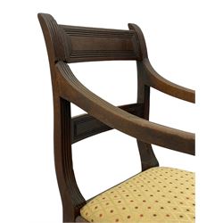 Georgian mahogany child's high chair on base, the rectangular cresting and middle rail with reed mould decoration, reeded uprights and down sweeping arms, on turned supports, upholstered drop in seat, the chair sat upon stand with rounded rectangular top on rear splayed and turned front supports, the chair detaches via a threaded dowel 
