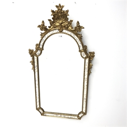 Gilt swept mirror with shell carved pediment, W65cm, H119cm
