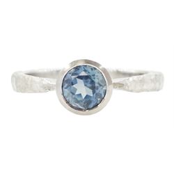 Platinum sapphire ring, single bezel set sapphire of approx 1.00 carat, to a planished sha...