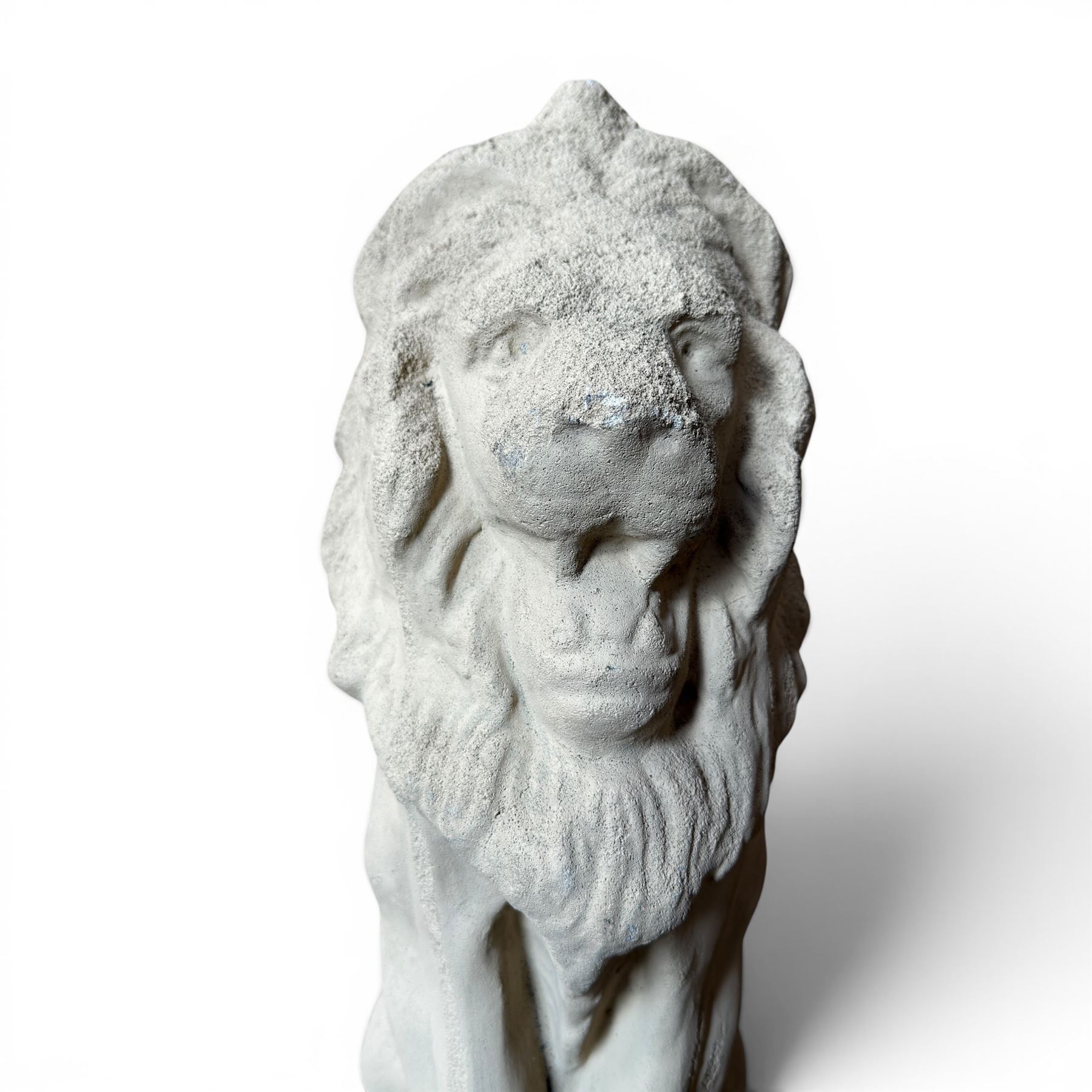 Pair of cast stone seat lions, male and female figure, and a miniature pair of cast stone lions