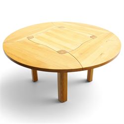 Contemporary round dining table and four orange faux leather chairs