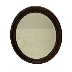 Early 20th century oval wall mirror, scumbled wood finish, bevelled plate in moulded frame