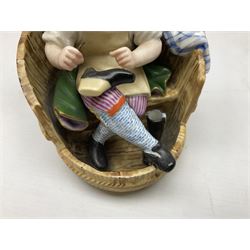 Pair of Continental figures in the Meissen style, modelled as a shoemaker and a laundress seated within wooden barrels with gingham cloth draped behind, H20cm