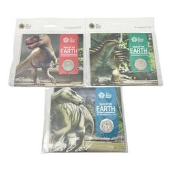 Three The Royal Mint United Kingdom 2020 'Tales of The Earth' commemorative fifty pence coins, comprising 'Megalosaurus', 'Hylaeosaurus' and 'Iguanodon', all on cards in plastic packaging (3)