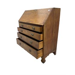Georgian oak bureau, fall front enclosing fitted interior, fitted with four long graduating drawers, on bracket feet