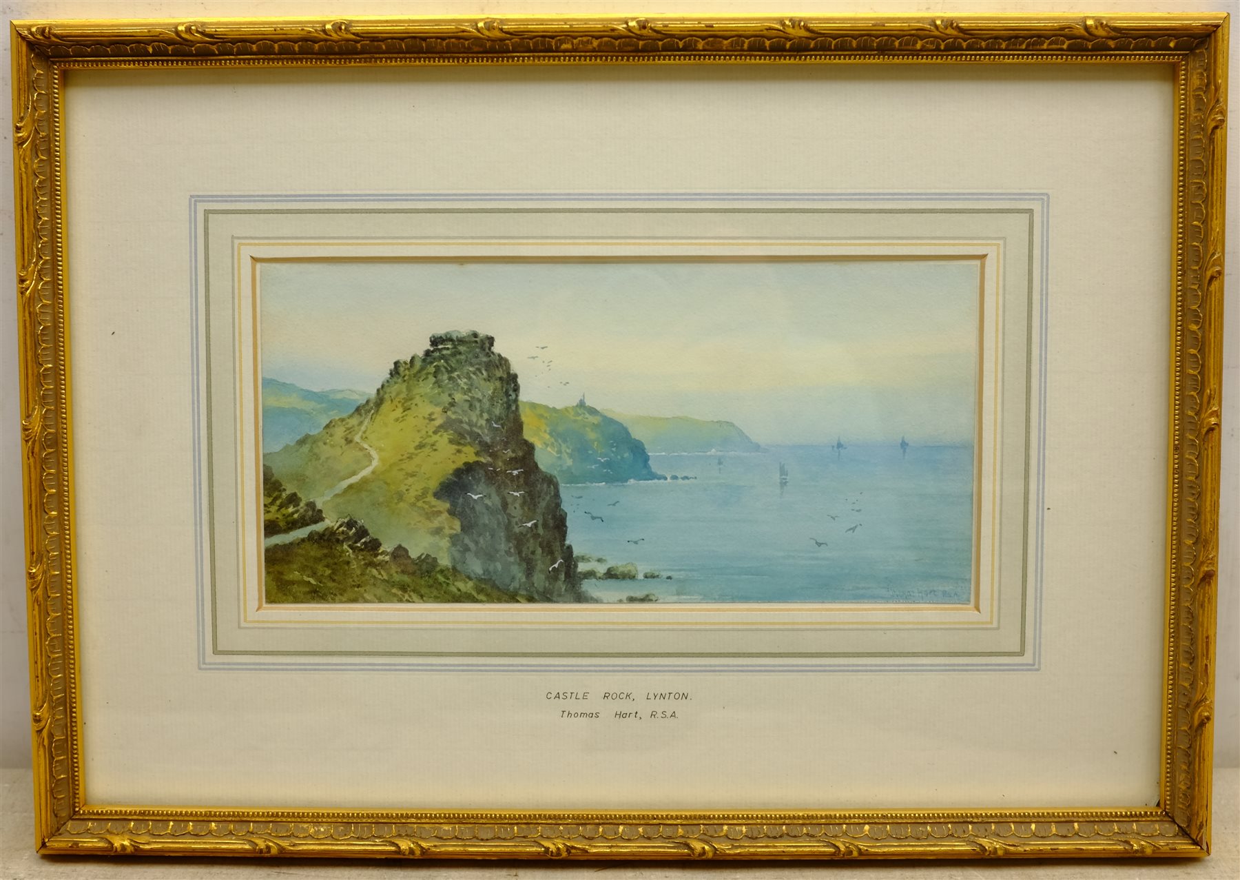  Thomas Hart (British 1830-1916): 'Castle Rock, Lynton', watercolour signed, titled on the mount, Geoffrey H Douthwaite (British 20th century): Scarborough Harbour, watercolour signed, and a drypoint etching of Chester indiscinctly signed in pencil, max 33cm x 47cm (3)  