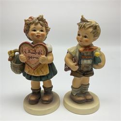 Four Hummel figures by Goebel, comprising Wedding, The Love Lives on, Valentine Joy and Valentine Gift, together with a stand for the valentine figures, largest H18cm