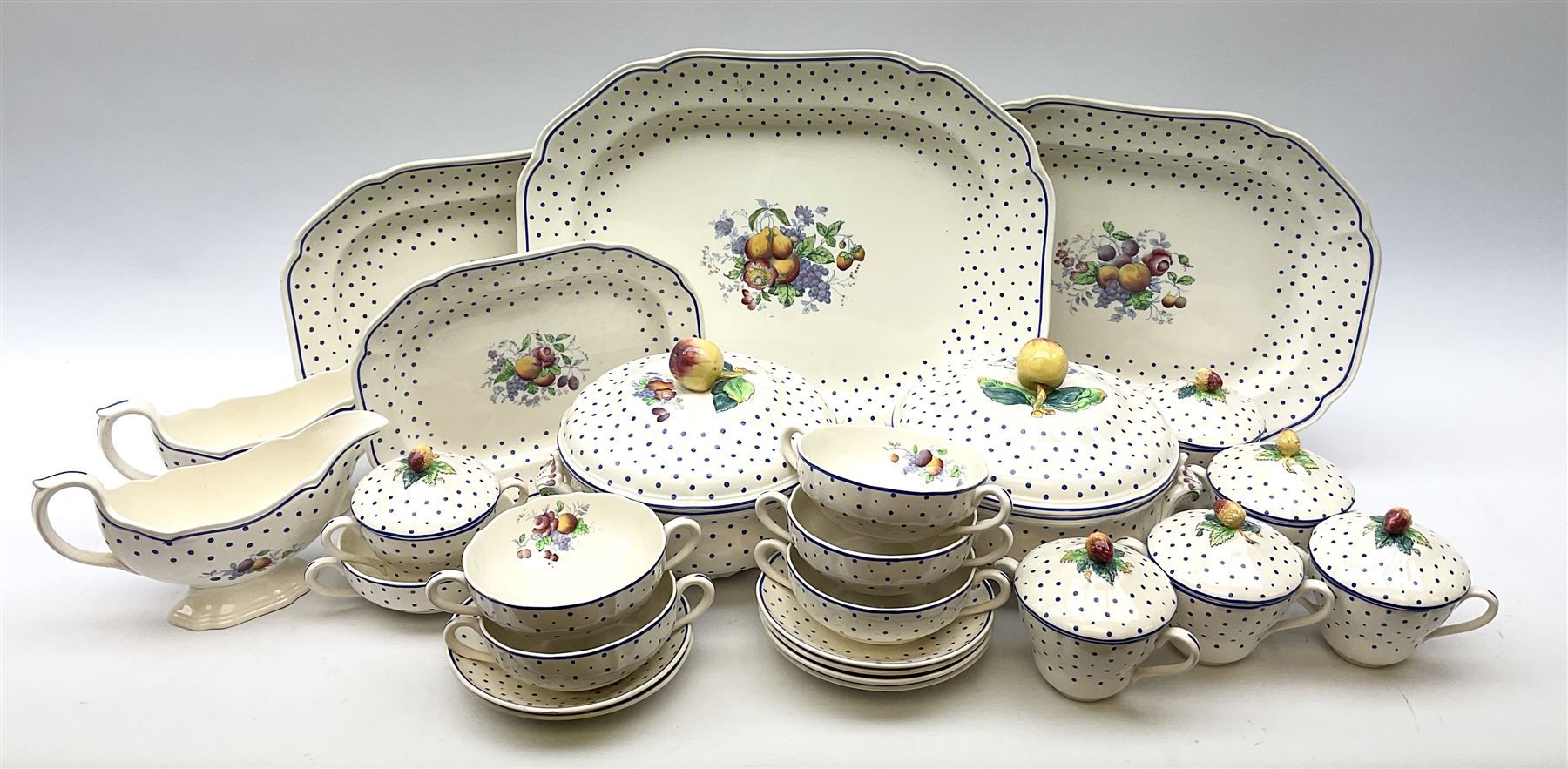 Copeland Spode Polka Dot pattern dinner and tea wares, comprising four dinner plates, seven salad plates, four dessert plates, six twin handled soup bowls and two saucers, six chocolate cups with covers and six saucers, two sauce boats, two tureens and covers, and four graduated serving platters. 