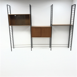 Staples Ladderax three bay sectional wall unit, two teak units comprising of solid and glazed sliding door cabinet, single shelf, W186cm, H201cm, D36cm