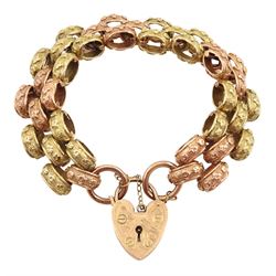 9ct rose and yellow gold  link bracelet, with heart locket clasp, each textured link decorated with flowerheads, Birmingham 1989, approx 45.7gm