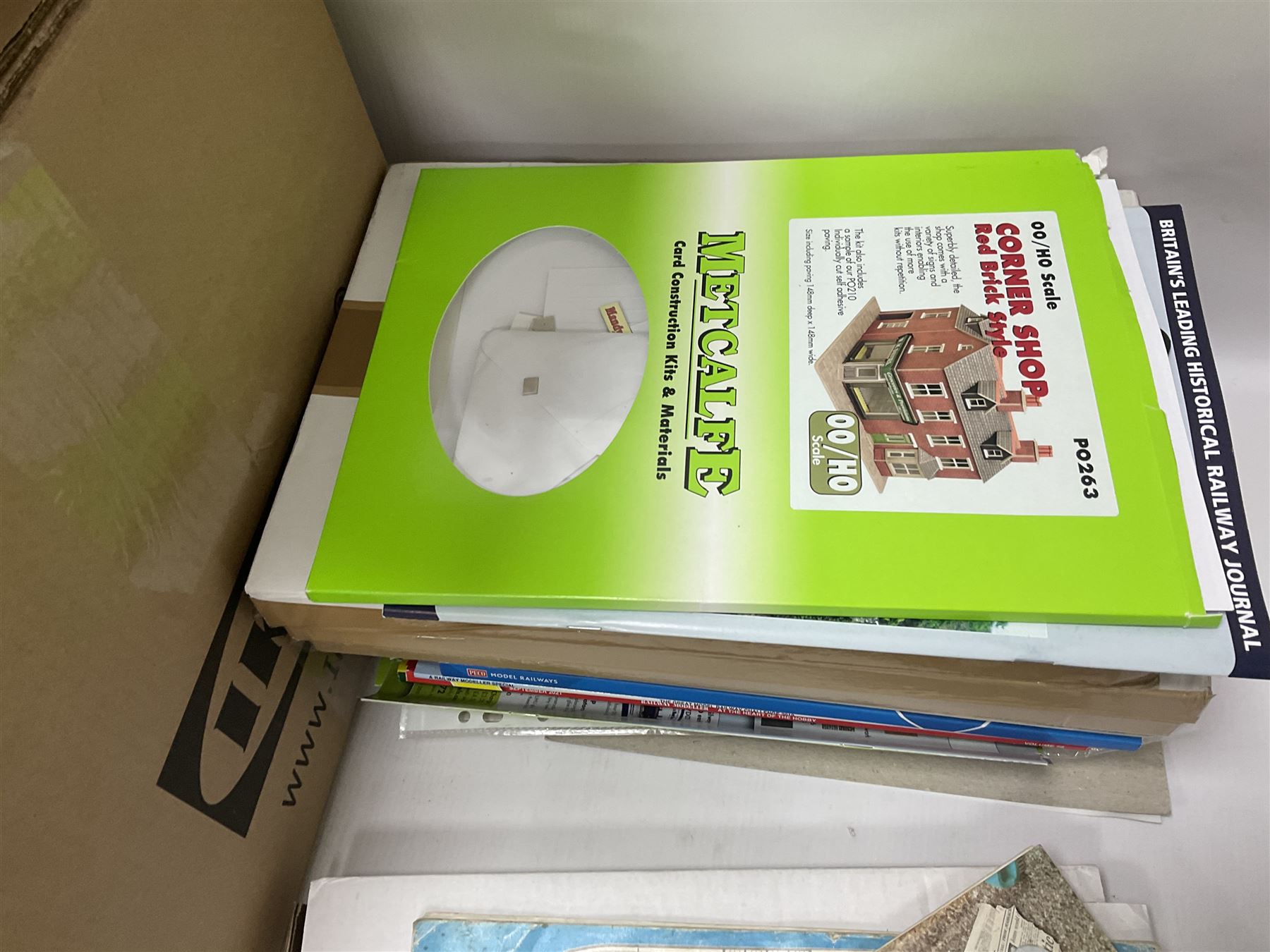 Extensive collection of scratch built buildings for use on ‘00’ gauge model railway layout, small amount of accessories and tools with a quantity of railway magazines and leaflets, in three boxes 