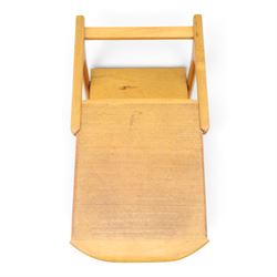 Mid-20th century teak side table with sliding top tray, raised sliding top above an open recess with two shelves, shaped frame support