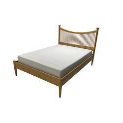 Arts & Crafts design oak double bedstead, concave shaped headboard with spindle supports