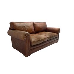 Large two seat sofa upholstered in tan 'Derwent' leather (W200cm D100cm H85cm), and matching armchair (W95cm)