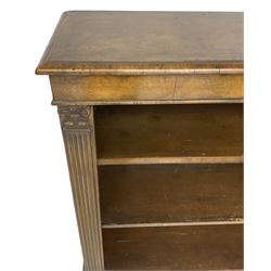 Georgian design walnut open bookcase, fluted uprights with acanthus carved capitals enclosing two adjustable shelves, on bracket feet