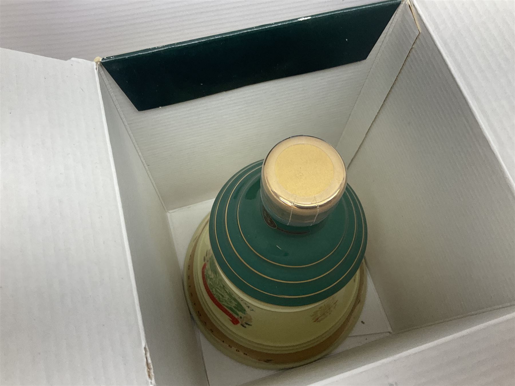 Dimple 15 Year Old Blended Scotch Whisky, together with nine Bells, scotch whisky, in Wade ceramic decanters, including Christmas 1991, 1998, 1996 etc, of various contents and proof 