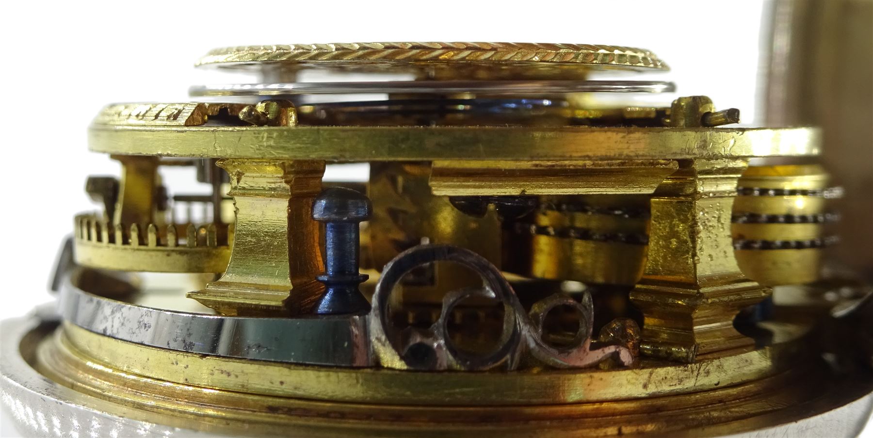 George III silver pair cased verge fusee pocket watch by David Crawford, Newcastle, No. 671, square baluster pillars, pierced and engraved balance cock, enamel polychrome dial depicting a figure fishing by a bridge, Roman hours and Arabic outer minute ring, beetle and poker hands, bull's eye glass, case markers mark D.P, London 1771