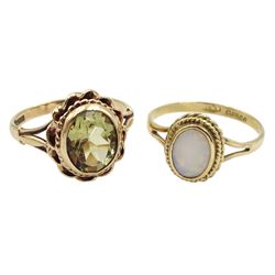Gold single stone oval green amethyst ring and a gold single stone oval opal ring, both hallmarked 9ct