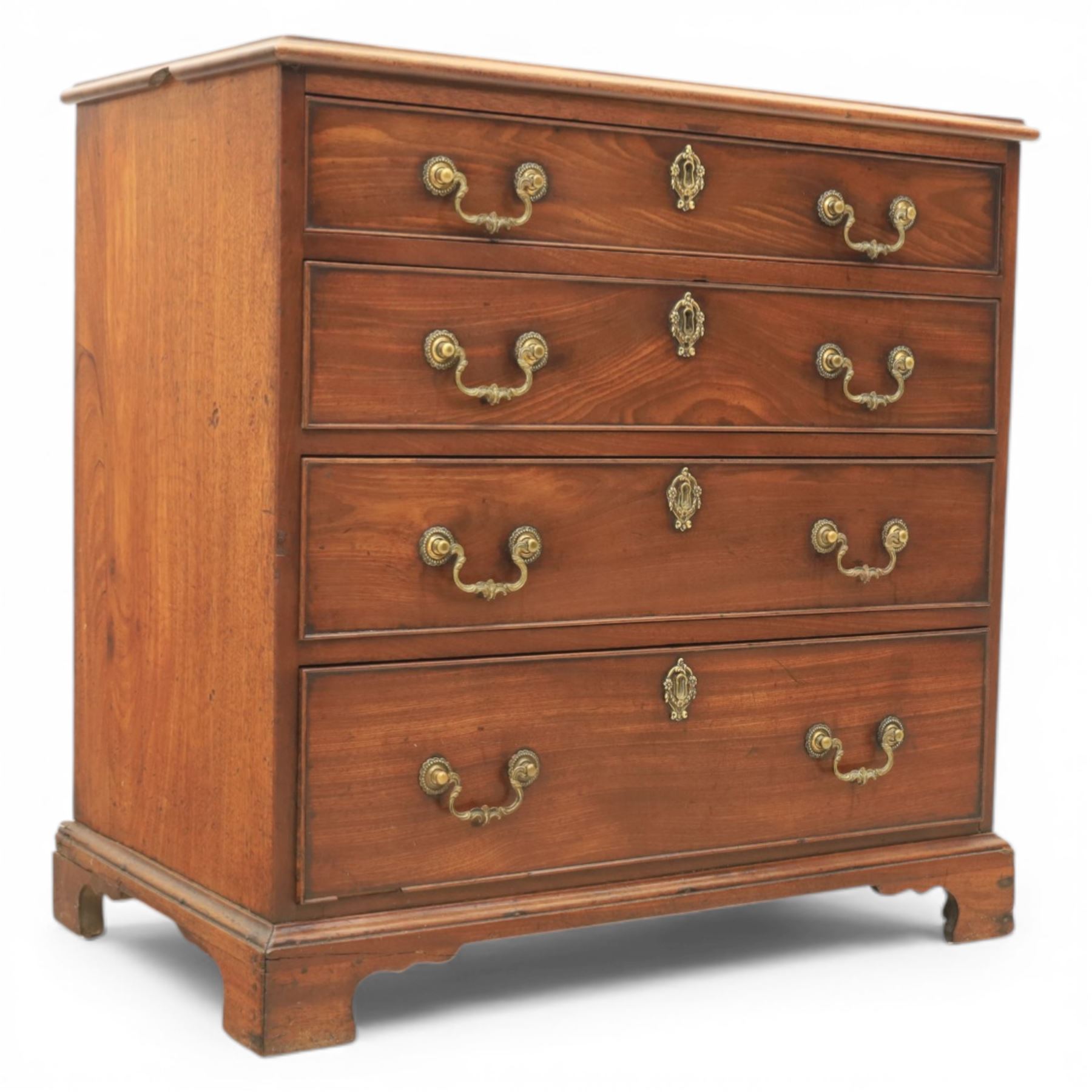 Georgian mahogany dwarf chest of drawers, the moulded rectangular top over four graduated drawers, fitted with brass drop handles, upon shaped bracket feet