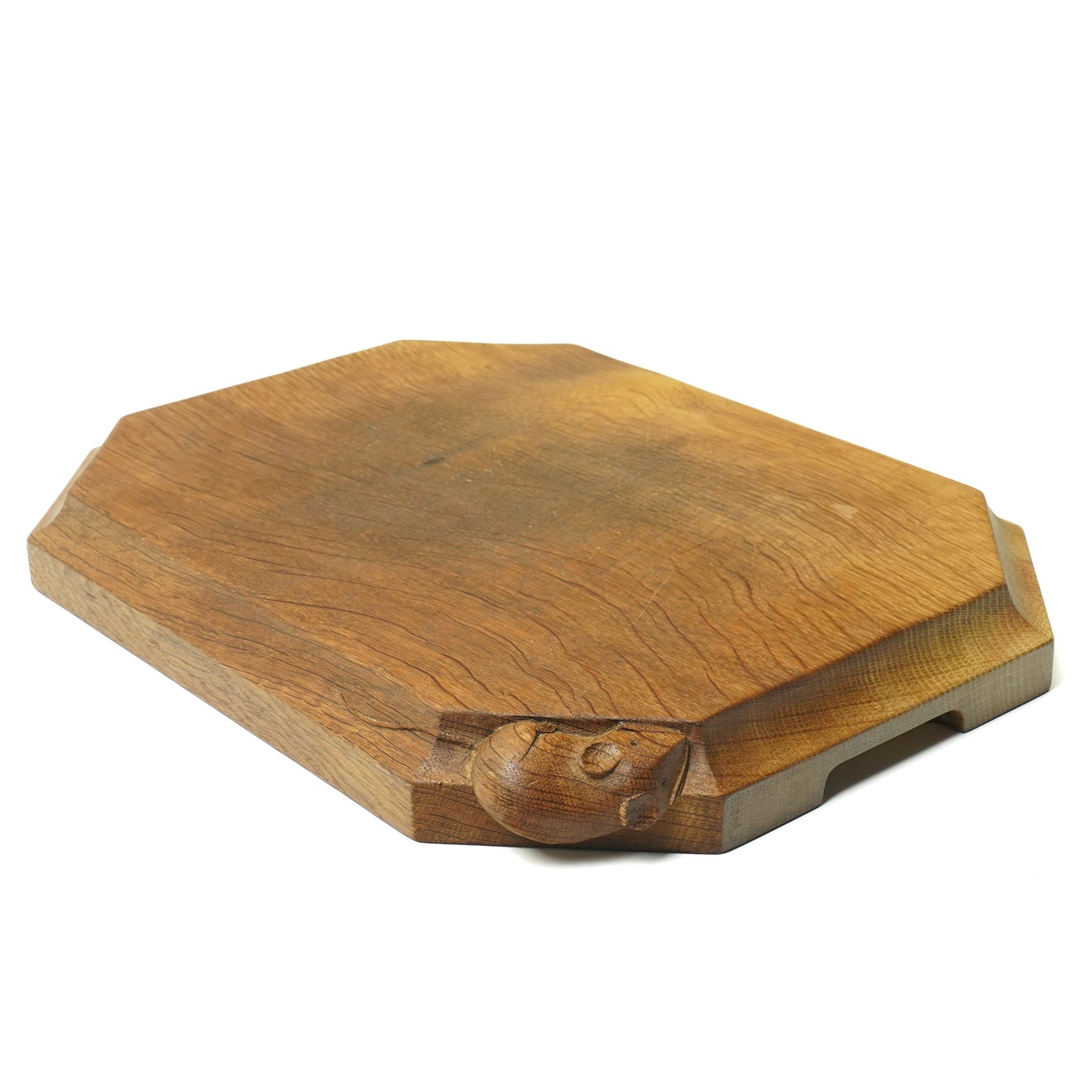 Mouseman - oak chopping board, of canted octagonal form with concave handles, with carved mouse signature, by the workshop of Robert Thompson of Kilburn