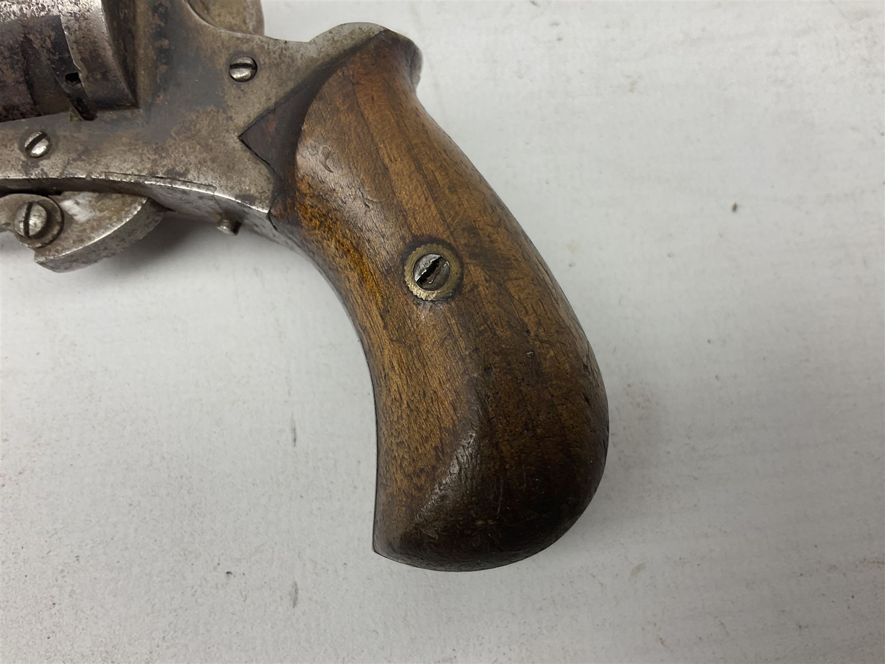 19th century 7mm five-shot pin-fire revolver, the cylinder marked 'The Savety (sic) American Revolver 1879', with folding trigger and two-piece walnut grip L18cm