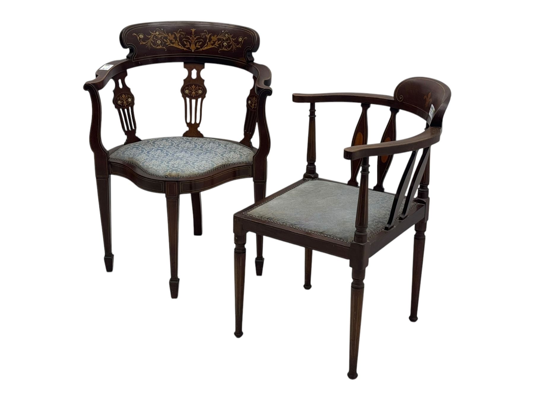 Edwardian inlaid mahogany corner chair, curved arms on shaped splat supports inlaid with satinwood, on turned supports (W60cm, H75cm); Edwardian inlaid mahogany tub-shaped armchair, the cresting rail inlaid with scrolling acanthus leaves and flower heads, on square tapering supports with spade feet (W58cm, H80cm)