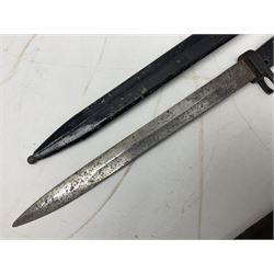 British No 7 MKI knife bayonet with 20cm single edged fullered clipped point blade;  blackened steel, large muzzle ring cross-guard; blackened swivelling pommel marked 'F5H'; red Tufnol composite grips; in blackened steel scabbard L33cm overall; British Pattern 1888 bayonet with scabbard; and German Ersatz bayonet with scabbard (3)