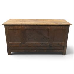 18th century carved oak coffer, rectangular hinged top over a lunette-carved frieze and tracery-style carved triple panelled front, the lower rail carved with repeating anthemion motifs, on square feet