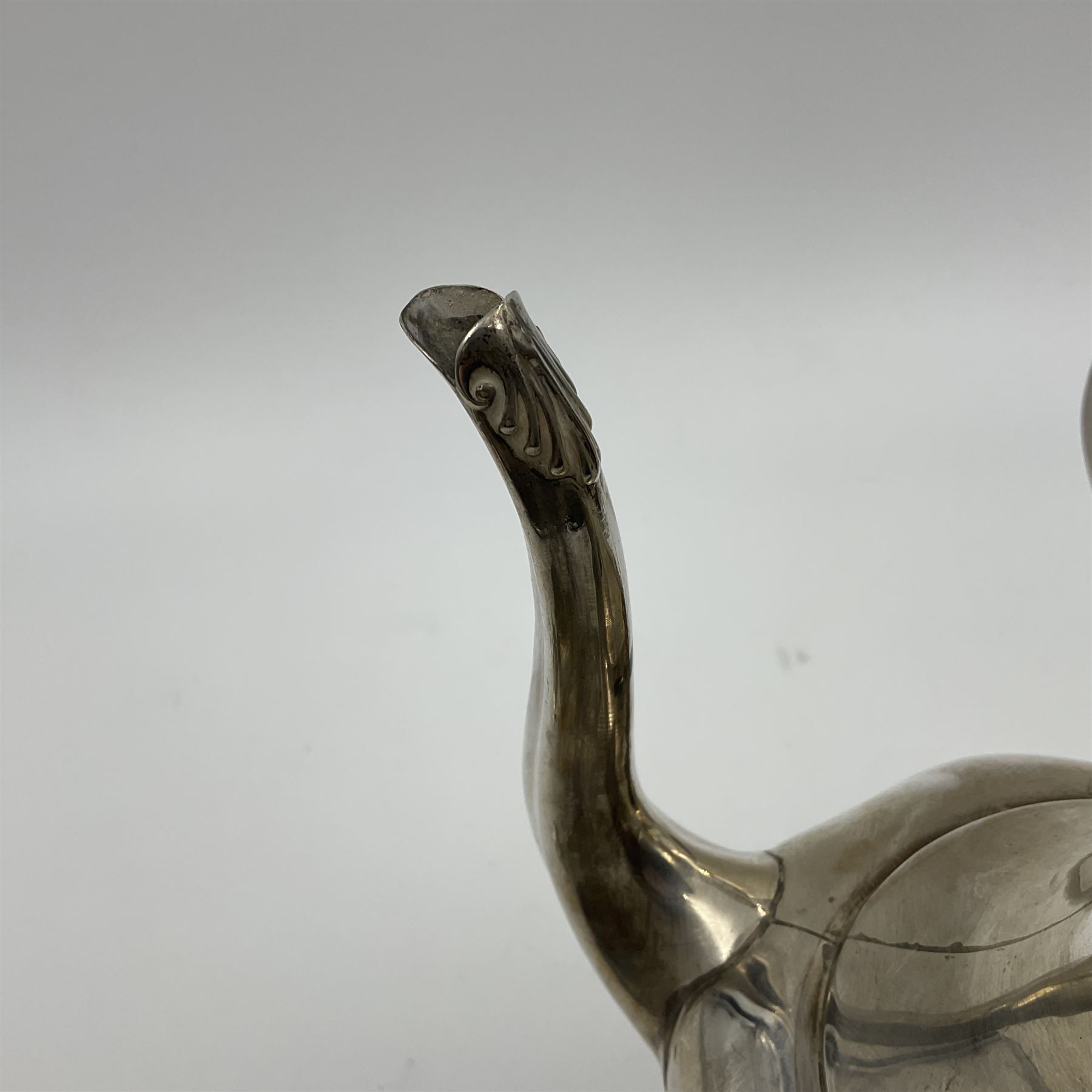 Five piece Edwardian silver tea service, comprising teapot and coffee pot, each with ebonised scroll handle, tea caddy with hinged cover, twin handled open sucrier, and milk jug, each of rounded bombe form, upon four paw feet, hallmarked William Adams Ltd, Birmingham 1904 and 1905, coffee pot H26cm
