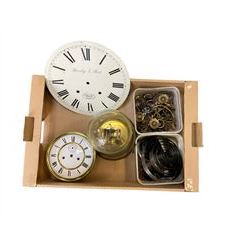 Assortment of clock parts including a two train Vienna regulator movement, 20th century torsion clock, various sized clock mainsprings, 12” painted wall clock dial and a container of brass furniture handles and fittings.