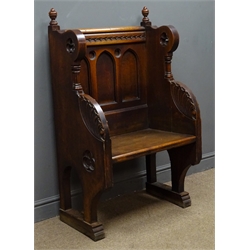  19th century Gothic revival single oak pew, finials above arched panelled black, shaped sides pierced with trefoil motifs and carved with foliage, sledge feet, W69cm, H119cm, D45cm  