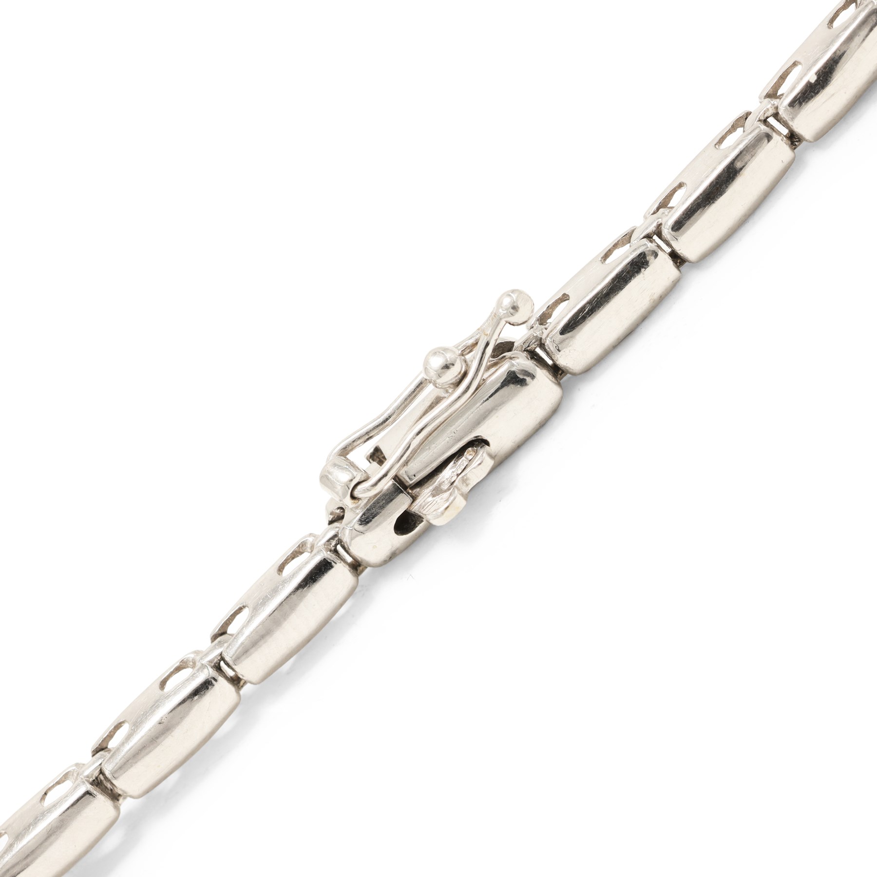 18ct white gold diamond necklace, bezel set with a single round brilliant cut diamond, spaced by two further diamonds, to a rectangular link necklace, London 2000, total diamond weight approx 0.75 carat