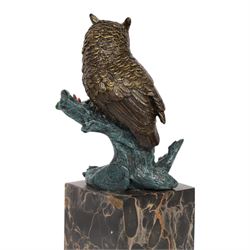 Cold painted bronze figure, modelled as an owl perched upon a tree stump signed Milo and with foundry mark, raised upon black veined marble plinth, H27.5cm