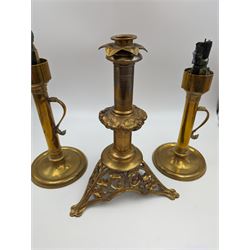 Brass candlestick with a knopt stems and triform base, together with two other brass candlestick 