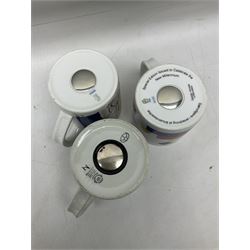 Set of three Royal Copenhagen year mugs, comprising 1976 with silver plaque stamped 925 beneath, and two 2000 examples, H11.5cm