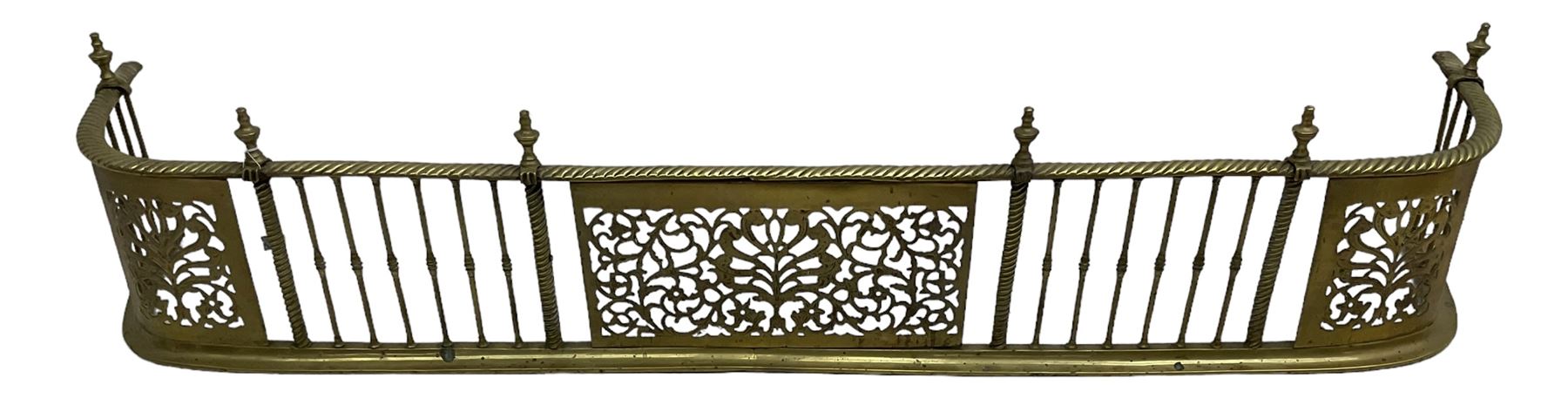 Early 19th century Irish brass D-shaped brass fender, twist borders and balustrade supports, central pierced frieze panel decorated with scrolling foliage and central anthemion motif  