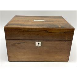 A 19th century rosewood toilet box, with mother of pearl escutcheon and plaque to the hinged cover, opening to reveal a part plush lined and compartmented interior, H7cm L28cm D20cm. 