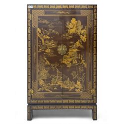 Chinese brown lacquered cocktail cabinet, decorated with gilt scenes of a traditional landscape with figures, pagodas, and mountainous scenery, double doors opening to reveal fitted interior with mirrored back, wine rack, shelves and cupboard, raised on square supports